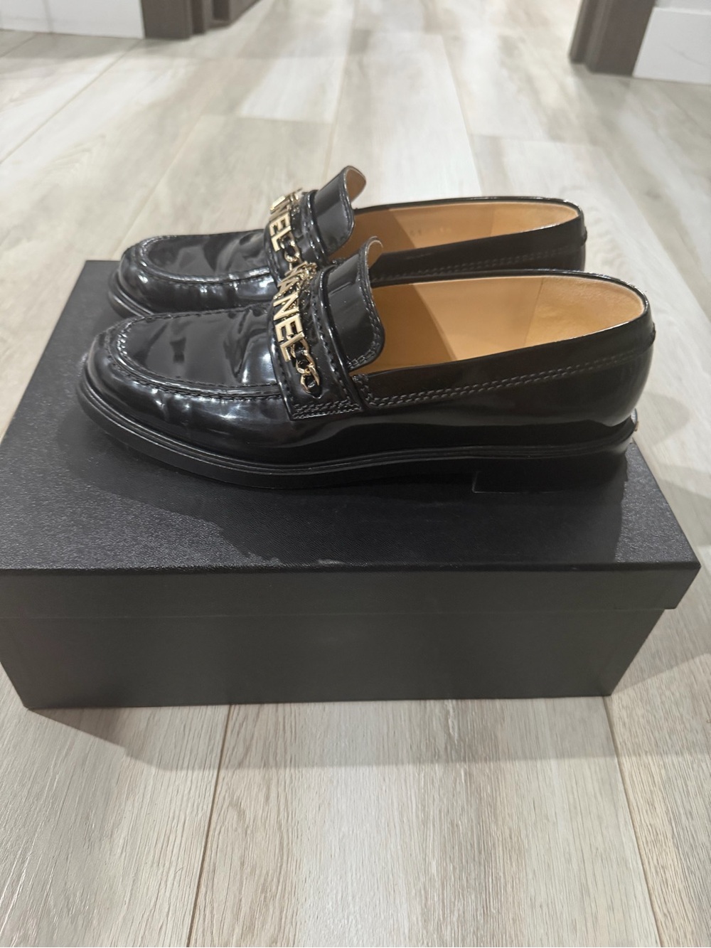 CHANEL Black Patent Leather Chain-Trim Loafers